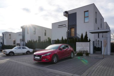 Krakow, Poland 25.10.2019: Modern new residential area in European city near green zone or park, low-rise light building for living. Residential quarter of new construction in sunny summer day