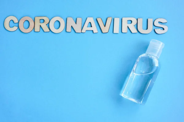 Antiseptic Inscription Coronavirus Made Wooden Letters Laid Out Blue Background — Stock Photo, Image