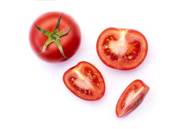 Whole and sliced tomato with basil leaves and garlic, spice, located around the edges for design isolated on white background