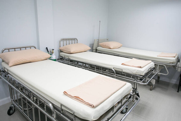 Recovery Room with bed and comfortable medical equipped in a hospital. Mattress with white cloth