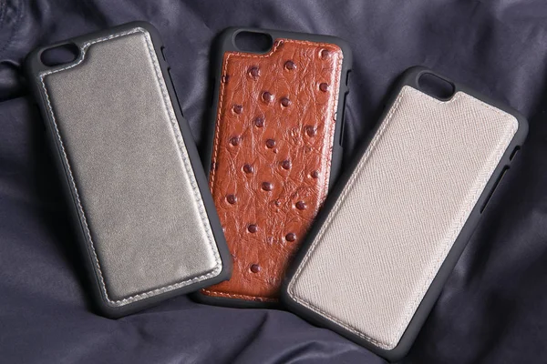 Leather phone case craftsmanship work on the white background.