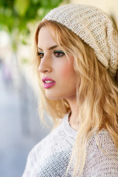 Close-up profile of blonde young woman with curly hair — Stock Photo, Image