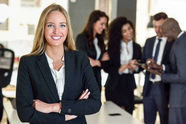 Businesswoman leader in modern office with businesspeople workin — Stock Photo, Image