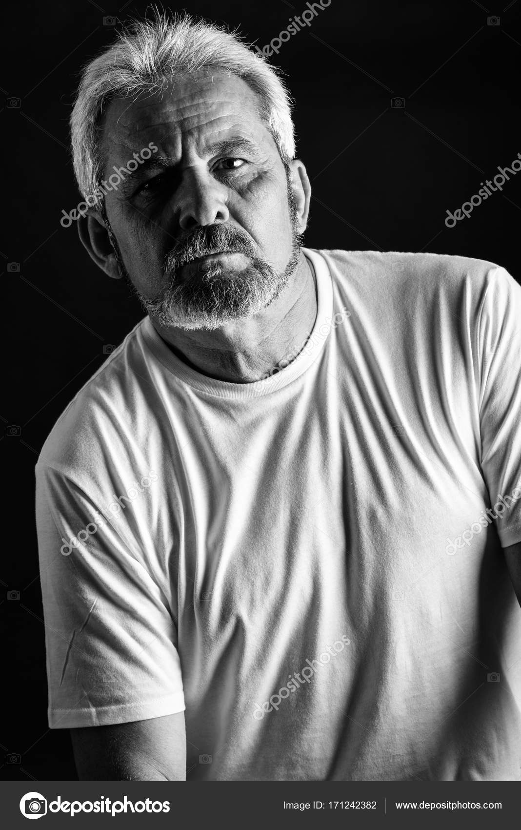 Serious Mature Man With White Hair And Beard Stock Photo