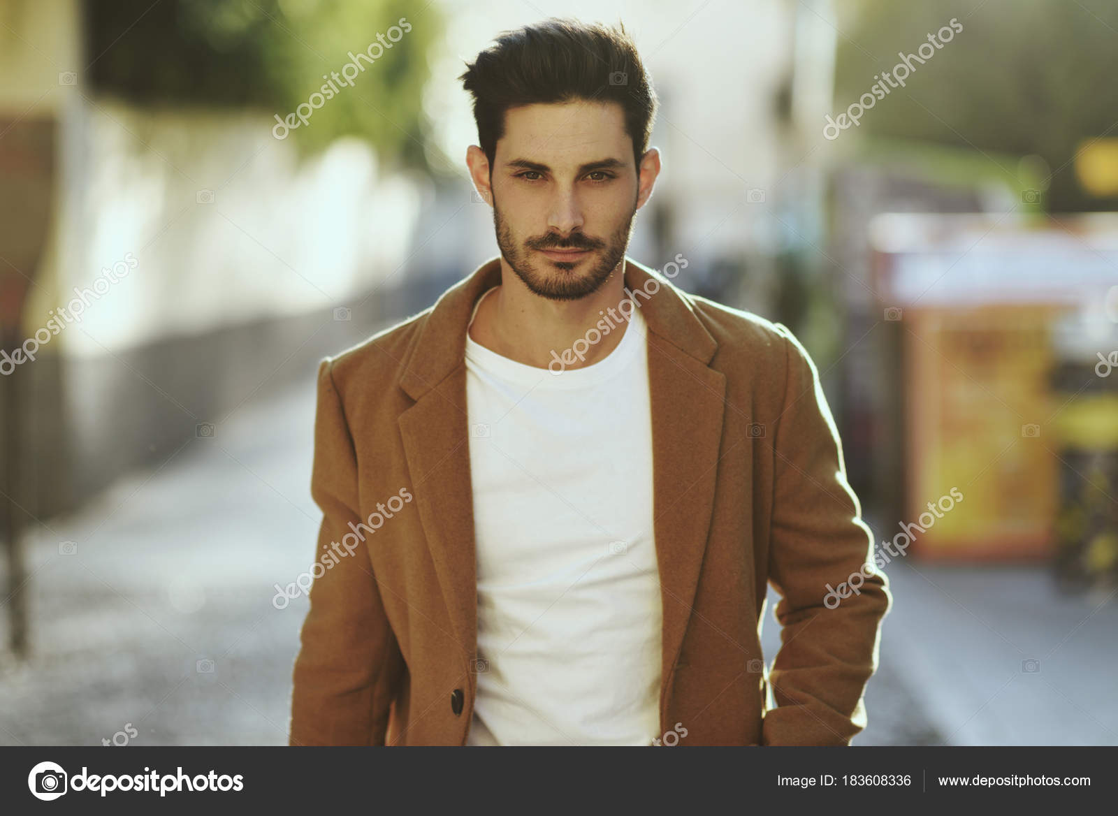 Young man wearing winter clothes in the street. Stock Photo by ©javiindy  183608336