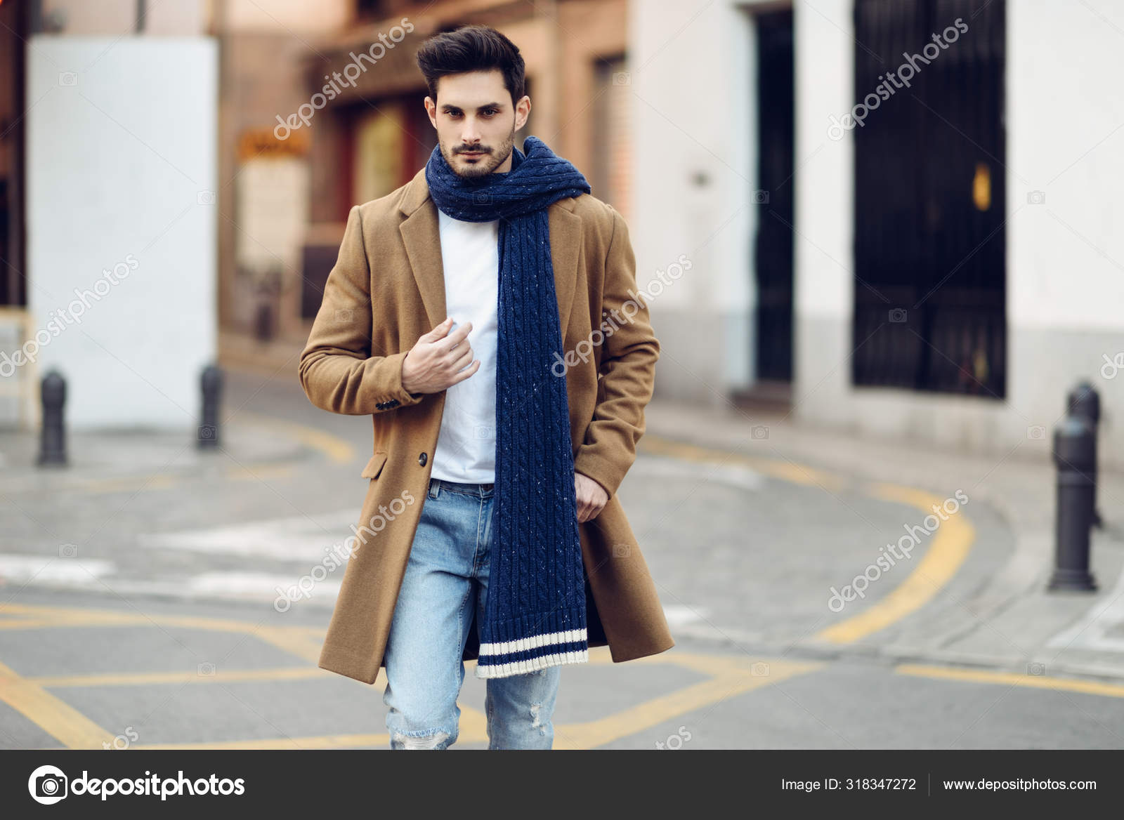 Young man wearing winter clothes in the street. Stock Photo by ©javiindy  318347272