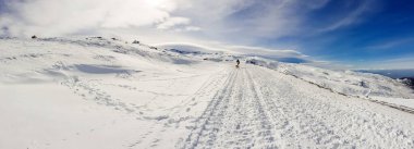 Ski resort of Sierra Nevada in winter, full of snow. clipart