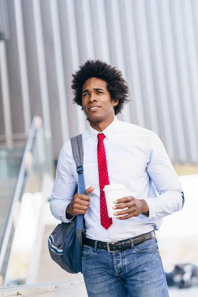 Smiling Black Businessman with a take-away glass. — Stockfoto