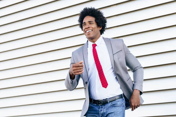 Happy Black Businessman wearing suit dancing outdoors. — Stock fotografie