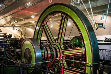 London, England, United Kingdom - May 24 2016: Victorian Tower Bridge Steam Engine Room Interior. 19th century technology inside the inner workings of Tower Bridge. clipart