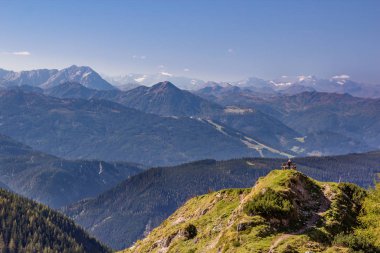 bright sky in the mountains look into the alps and a valley near a glacier dachstein