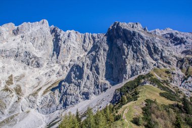 bright sky in the mountains look into the alps and a valley near a glacier dachstein
