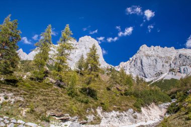 bright sky in the mountains look into the alps and a valley near a glacier dachstein