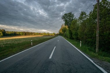 roadtrip with a dramatic sky and unknown destination