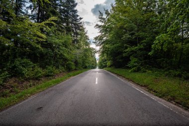 roadtrip with a dramatic sky and unknown destination