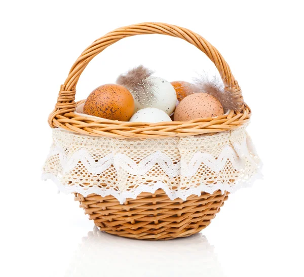 Fresh eggs in a basket, on a white background — Stock Photo, Image