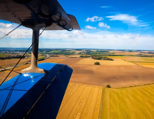 Earth and plane wing view from an illuminator — Stock Photo, Image