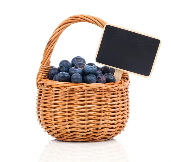 Bilberry in a basket to the board for text, on a white backgroun — Stock Photo, Image