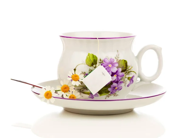 Camomile tea on a white background — Stock Photo, Image