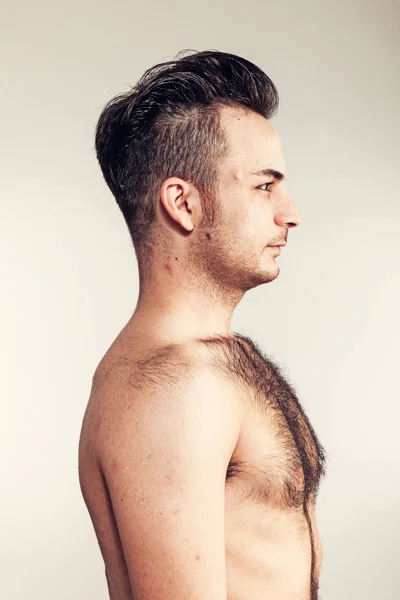 Boy with naked hairy chest on white background — Stock Photo, Image