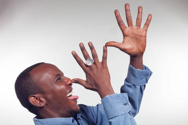 Young African boy with mocking gesture — Stock Photo, Image