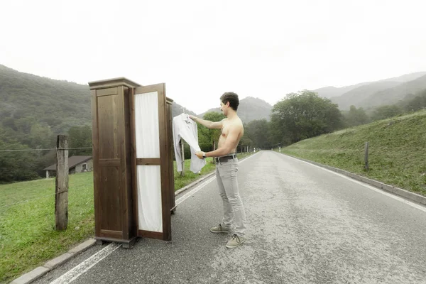 Wooden wardrobe with a man — Stock Photo, Image