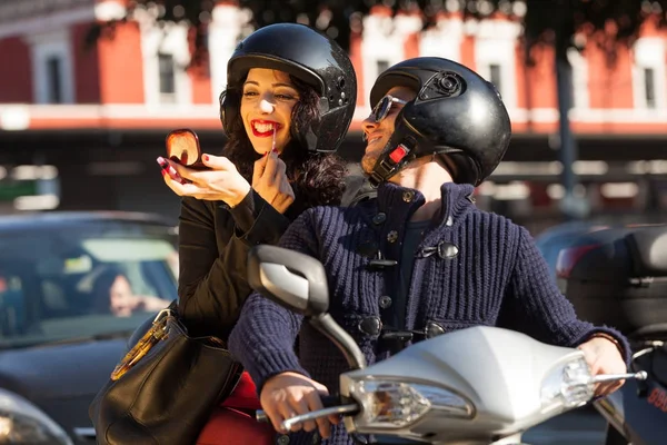 Young couple in scooter — Stock Photo, Image