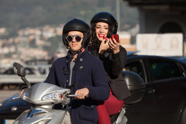 Young couple in scooter — Stock Photo, Image