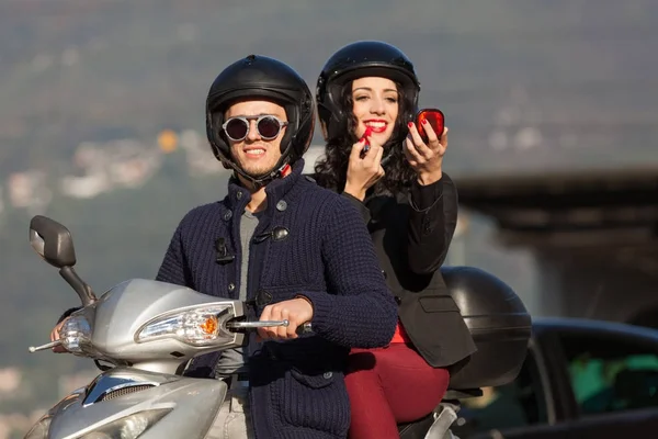 Young couple in scooter — Stock Photo, Image