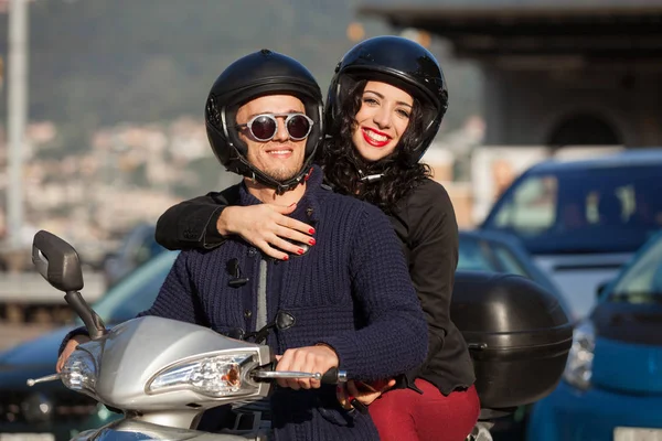 Young couple in scooter — Stock Photo, Image