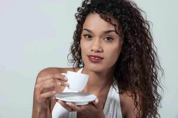 Young woman drinks a coffee — Stock Photo, Image