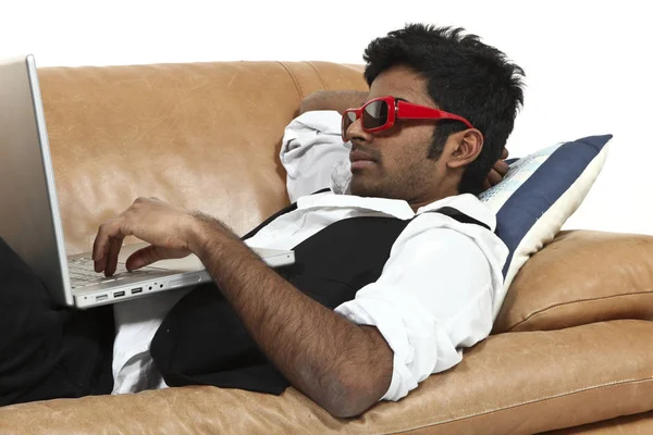 Young man on the couch — Stock Photo, Image