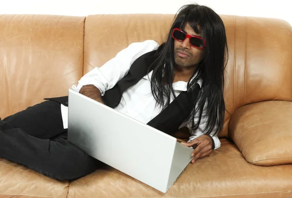 Young man on the couch — Stock Photo, Image