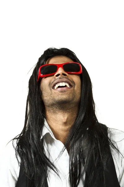 Photo studio portret: młody człowiek z długimi włosami — Zdjęcie stockowe