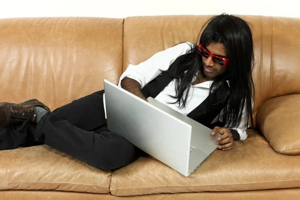 Young man on the couch — Stock Photo, Image