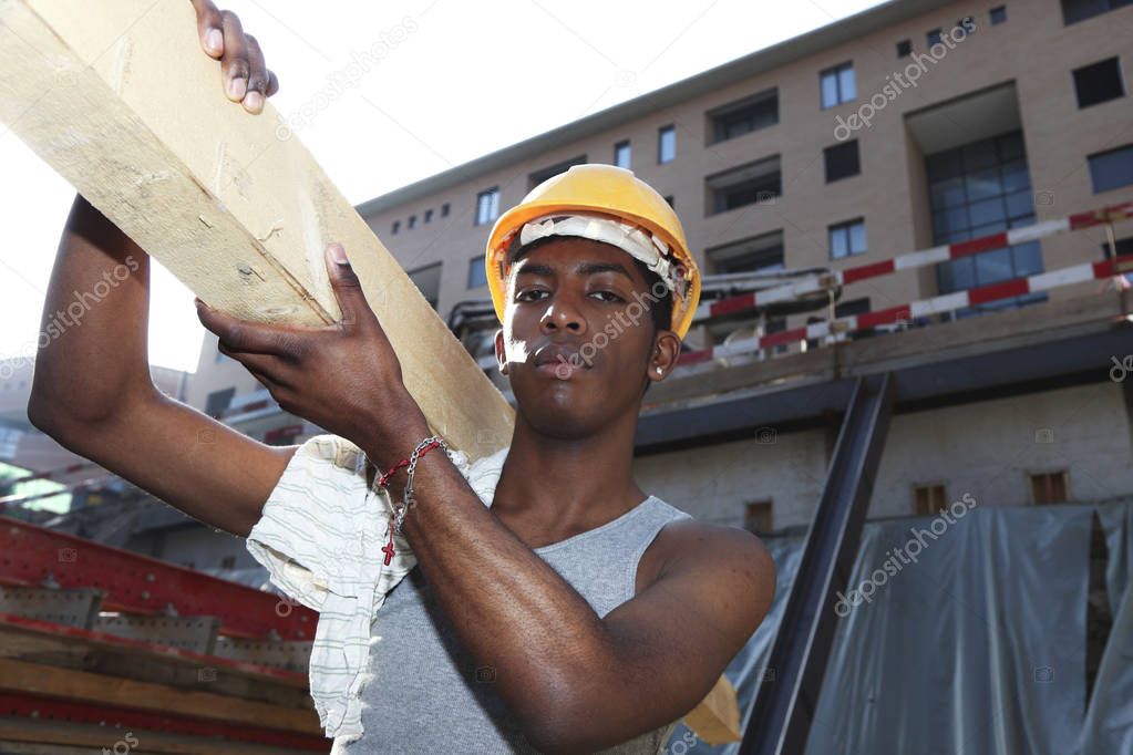 young african man working in construction site 