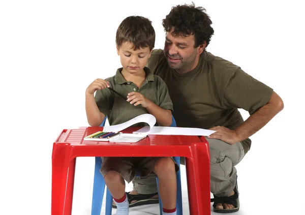 Adulto ayudando al niño con la tarea —  Fotos de Stock