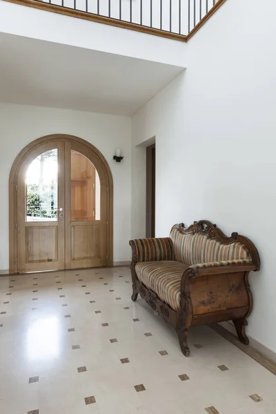 Corridor with antique sofa — Stock Photo, Image