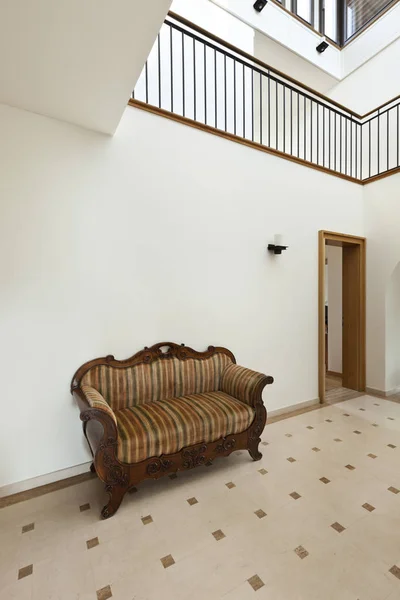 Corridor with antique sofa — Stock Photo, Image