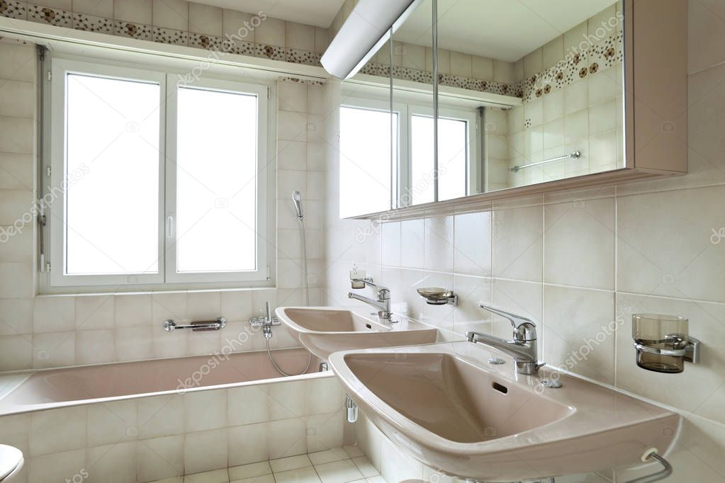 interior furnished and tiled bathroom