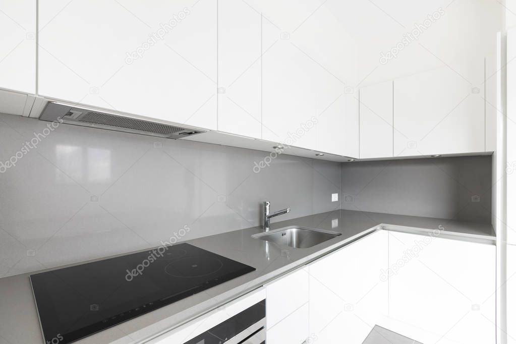 Detail of modern white kitchen, corner detail, clean space