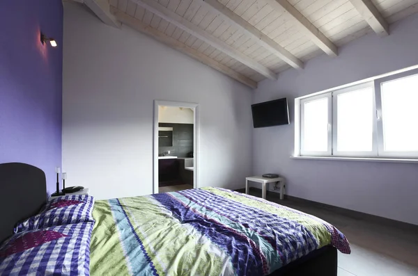 Modern bedroom in the attic