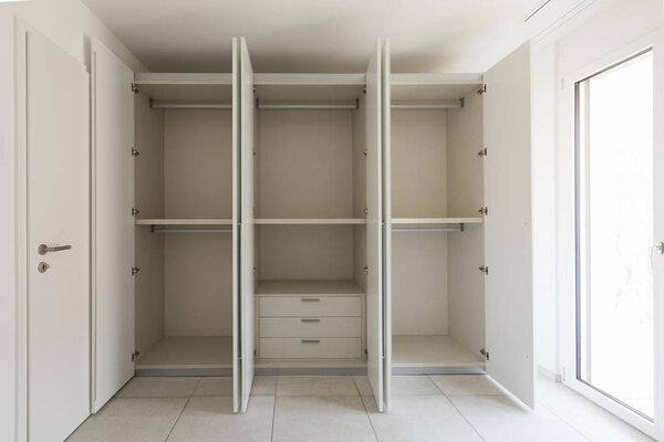 Empty room with large wardrobe
