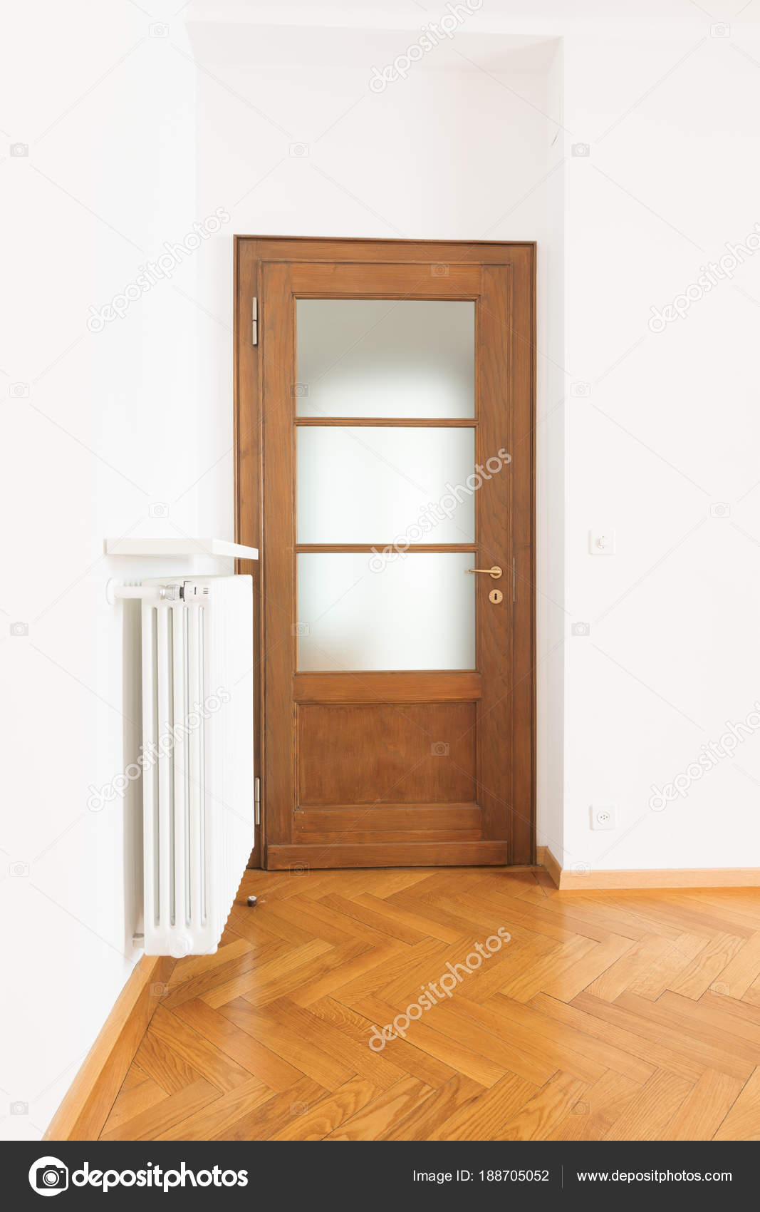 Empty Room In A Apartment With White Walls And Wooden Floors Stock Photo C Zveiger 188705052