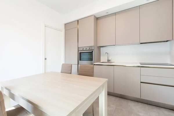 Modern kitchen in total white apartment — Stock Photo, Image