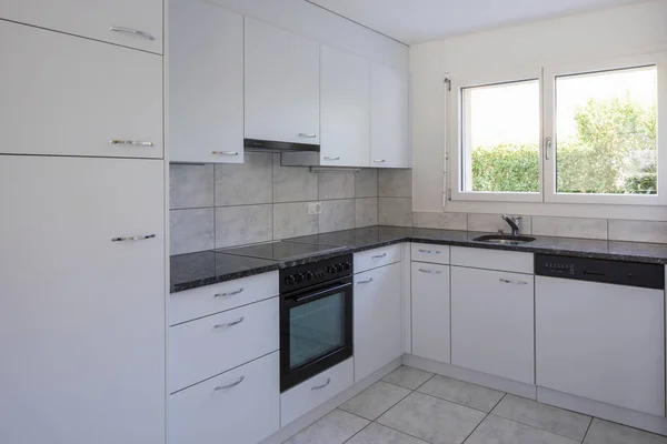 Vintage white kitchen with large tiles — Stock Image Vintage white kitchen with large tiles Stock Photo