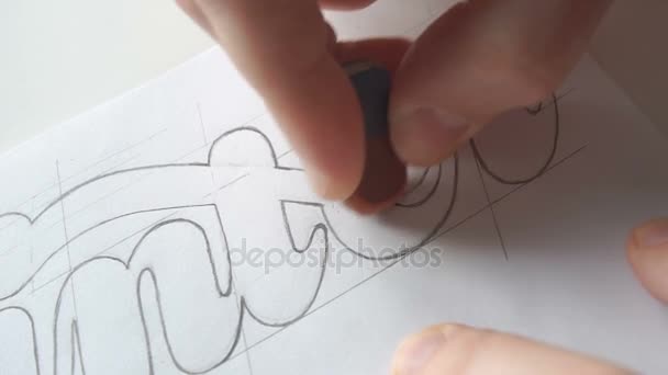 Designer drawing letters with pencil — Stock Video