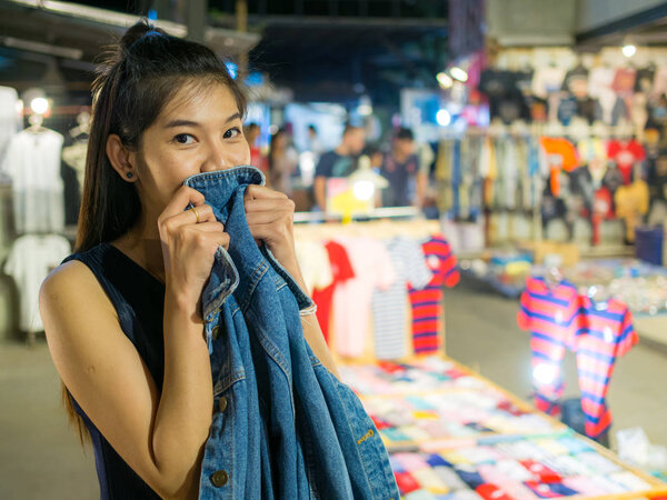 woman with shopping in night market