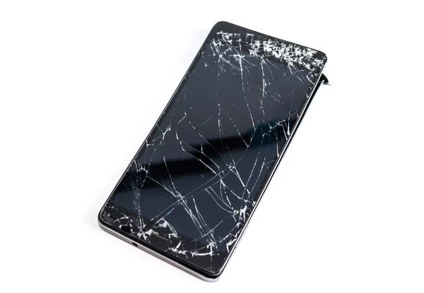 Telefone celular com tela quebrada — Fotografia de Stock