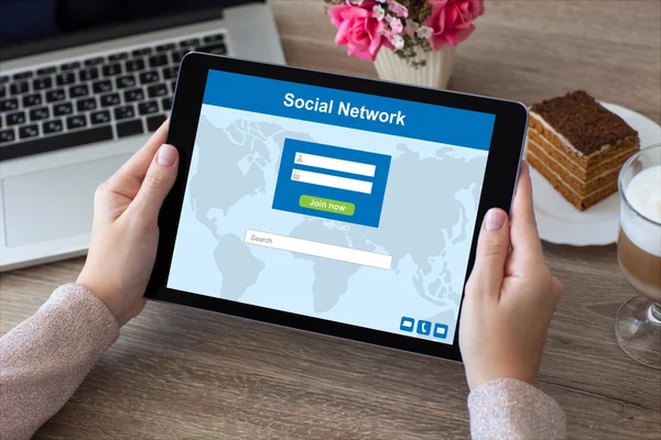 woman hands holding tablet computer PC social network and laptop